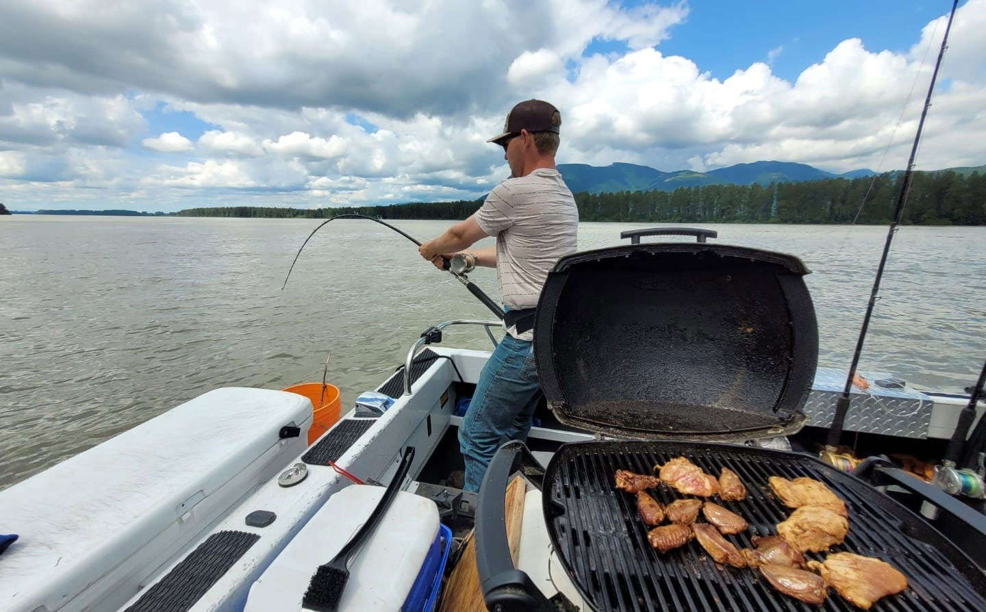 Catching a sturgeon on the Fraser River while waiting for lunch